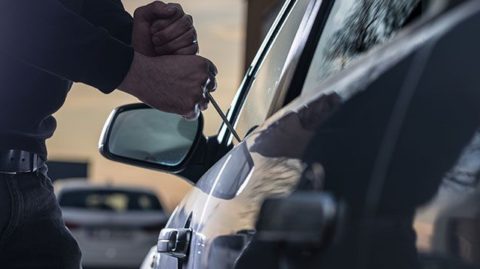 Person breaking into car